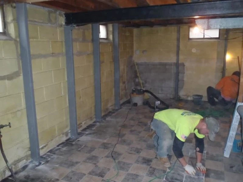 Basement wall reinforcement with steel I-beams for foundation repair in Amarillo
