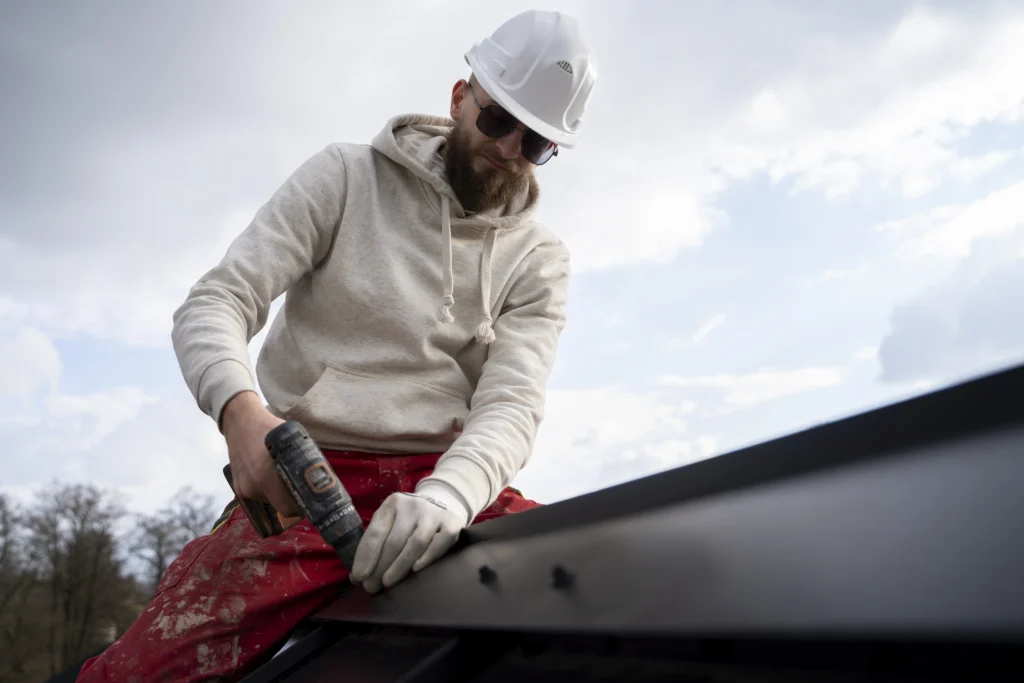 Professional gutter installer working on a home in Amarillo, TX