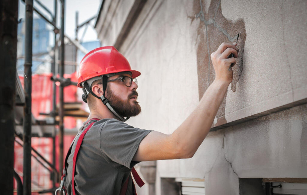 Structural engineer inspecting exterior foundation cracks in Amarillo, TX